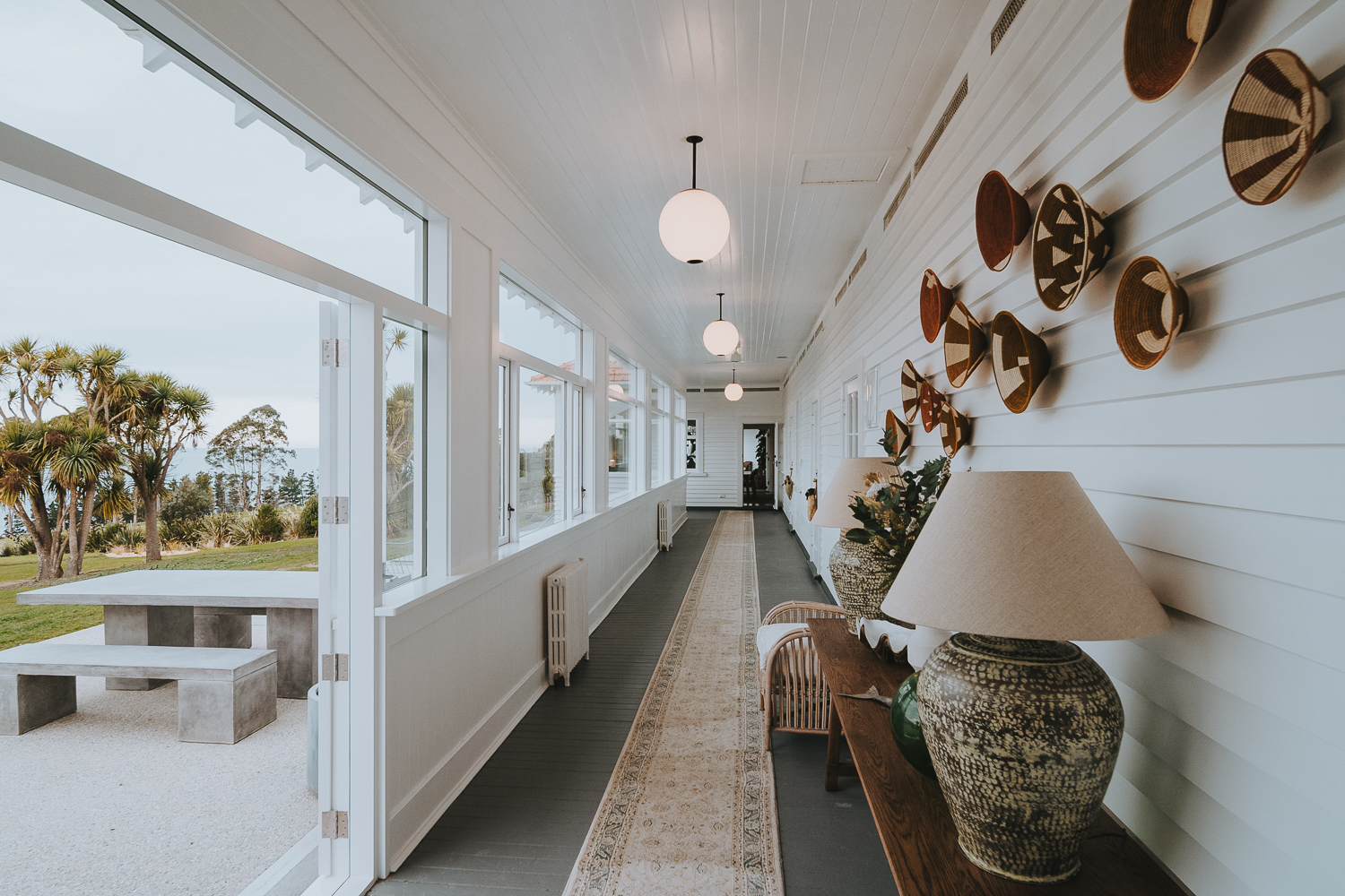 The Longhouse Tirimoana Whare Roa entry and covered verandah pario and views of the coast