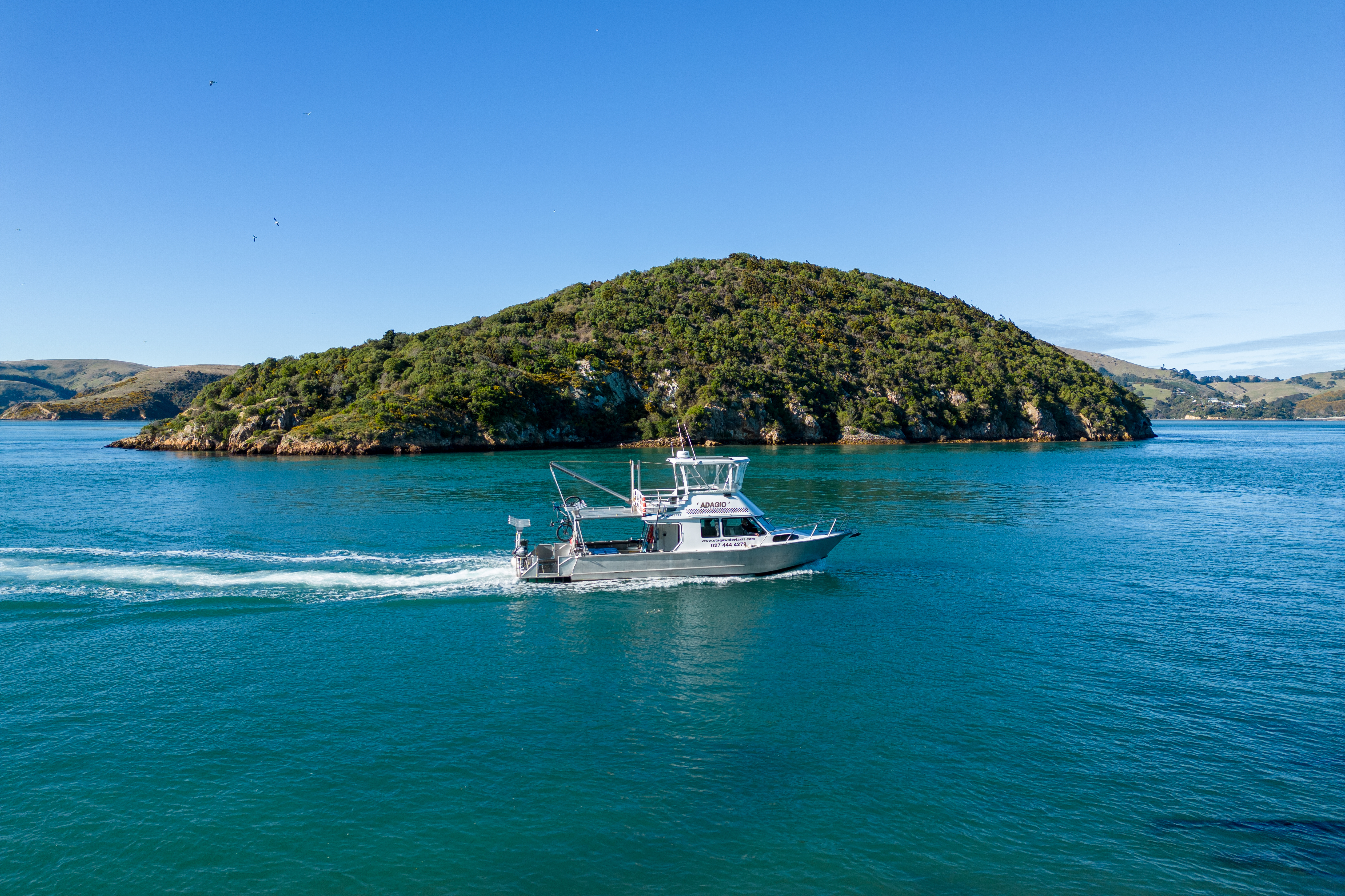 Our sightseeing vessel Adagio passing between the Halfway Islands