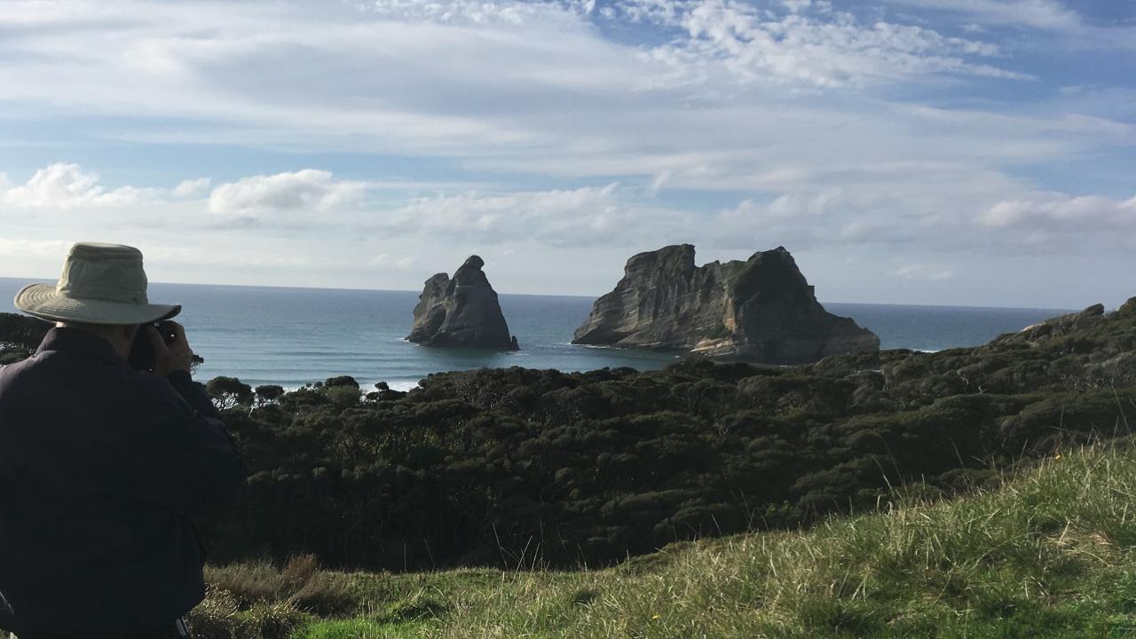 The coast opens up before you