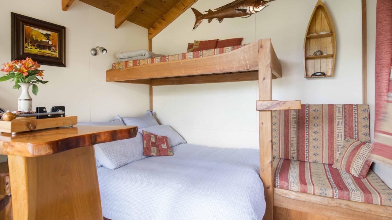 Double bed, upper bunk for storing luggage