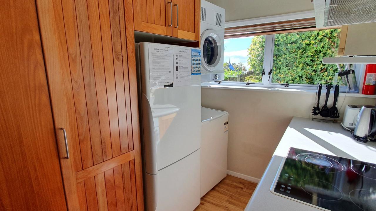 Laundry area (washer and dryer) in kitchen
