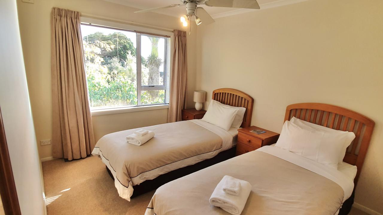 Bedroom 2 with two single beds (can be configured as king by request).
