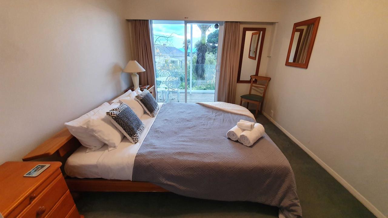 Master bedroom with comfortable king bed
