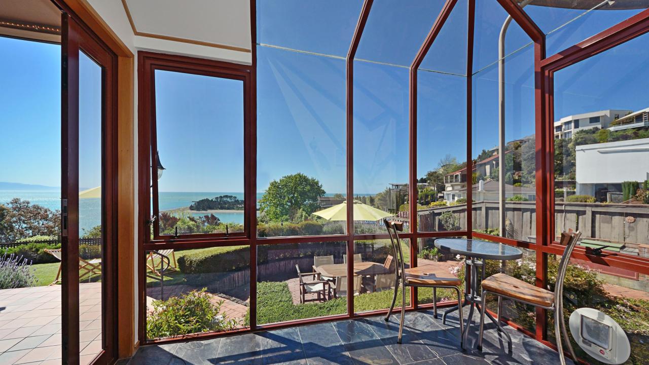Sunroom to outdoor dining with gas BBQ
