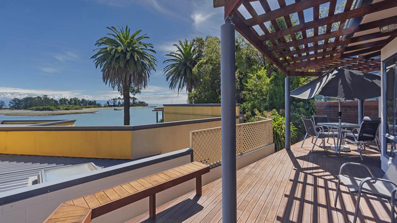 Outdoor dining area with views over Tasman Bay