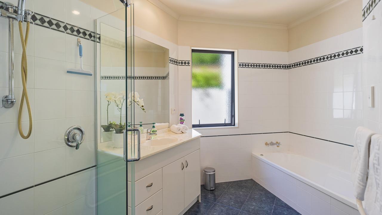 Main bathroom with bath, shower & vanity - separate toilet
