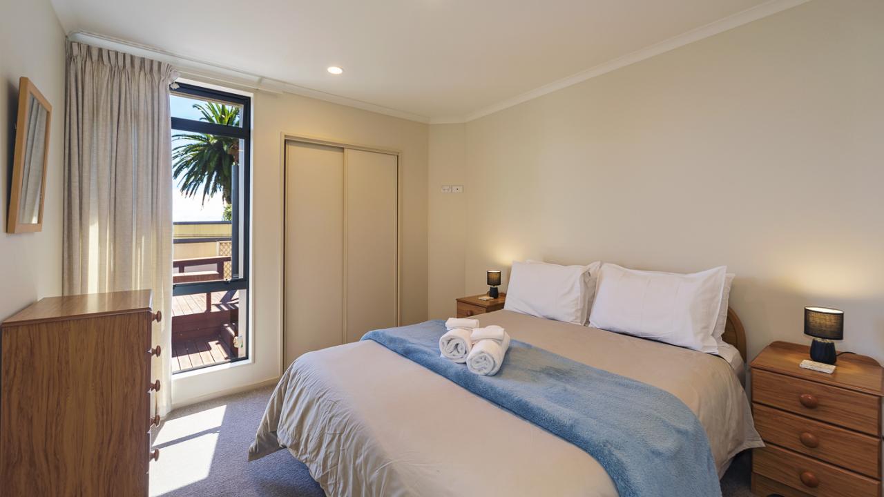 Bedroom 2 with queen bed & views over Haulashore Island
