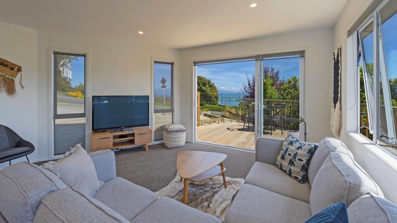 Living opening to deck & views
