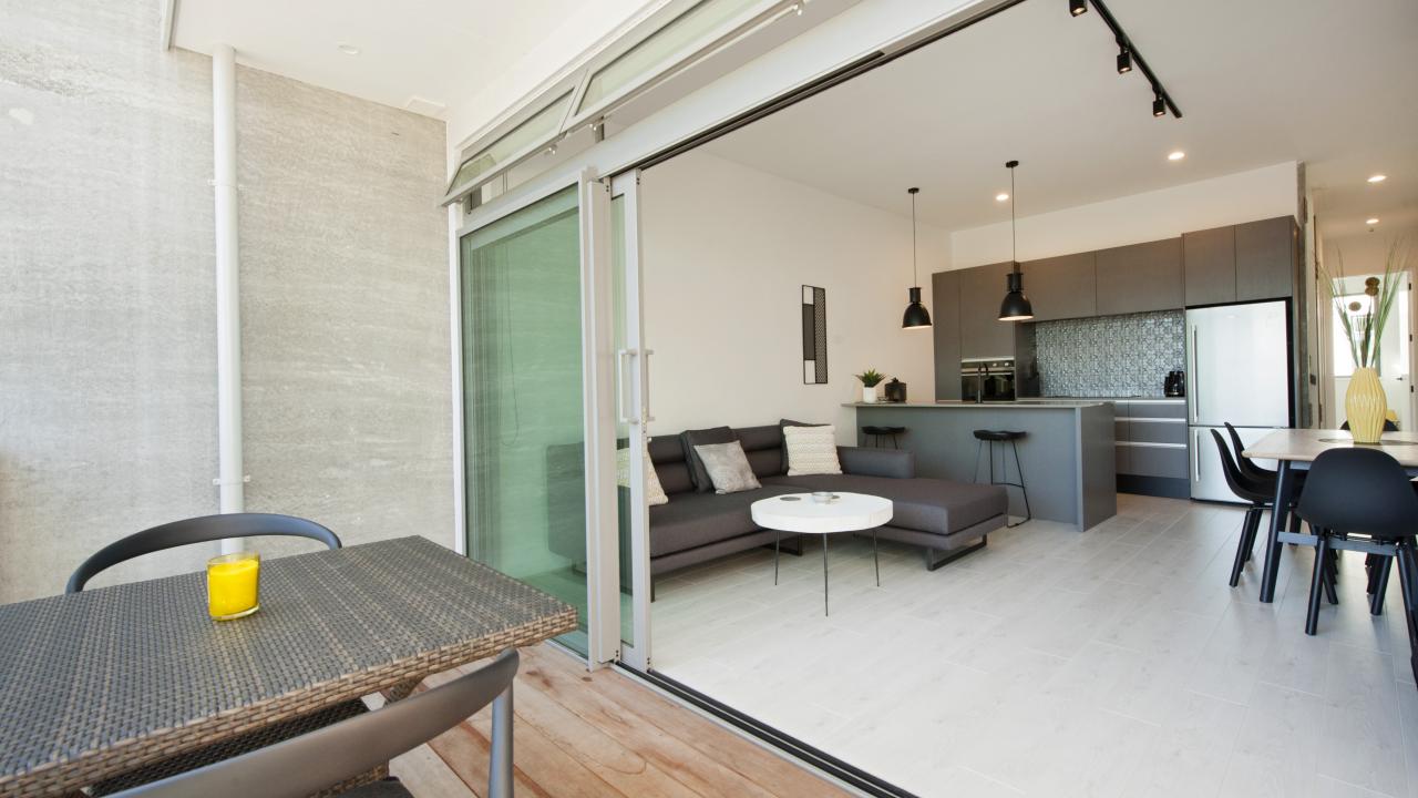 Dining balcony to open-plan living, dining and kitchen