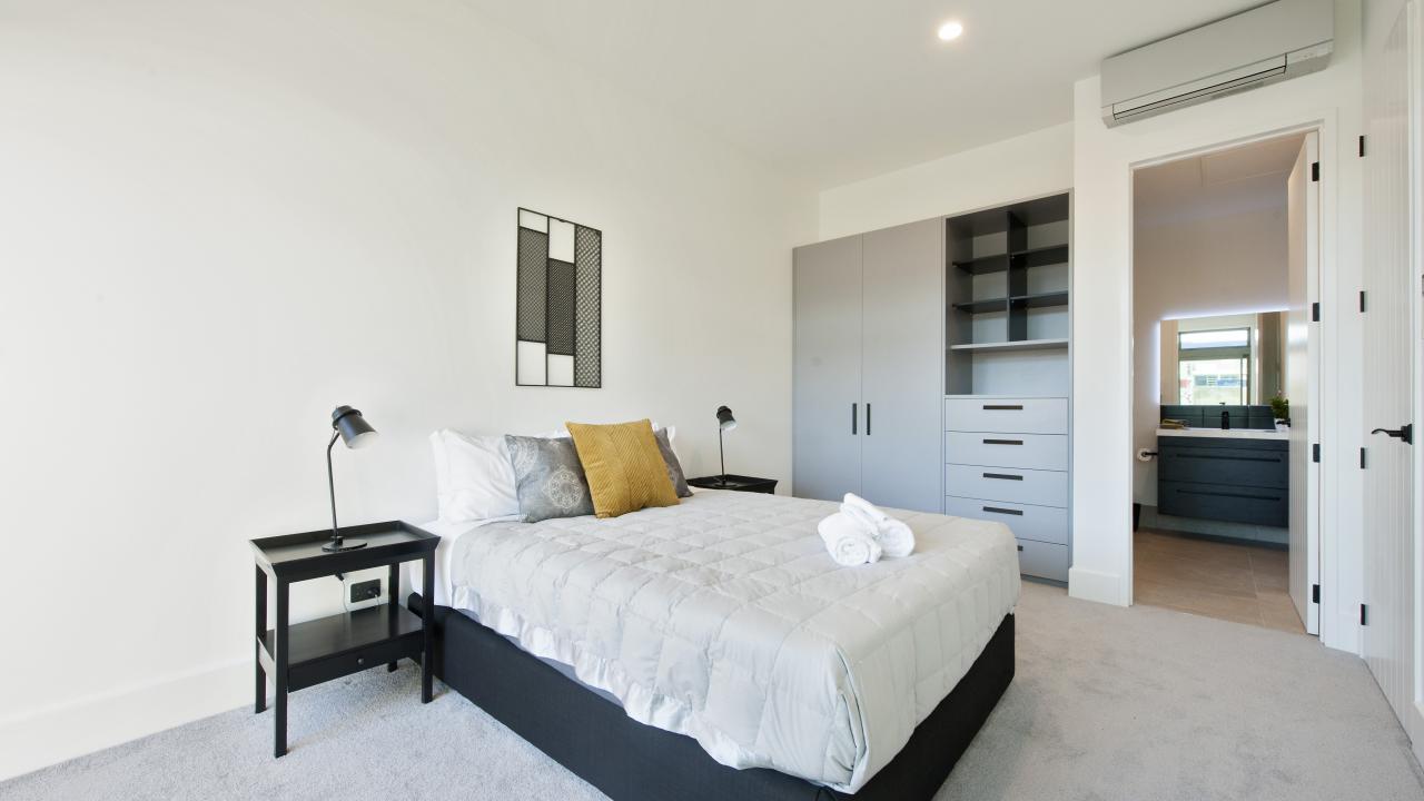 Downstairs master bedroom with balcony & ensuite bathroom
