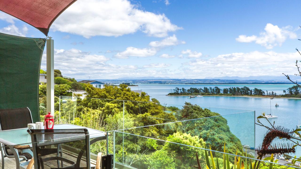Outdoor dining balcony with seaviews