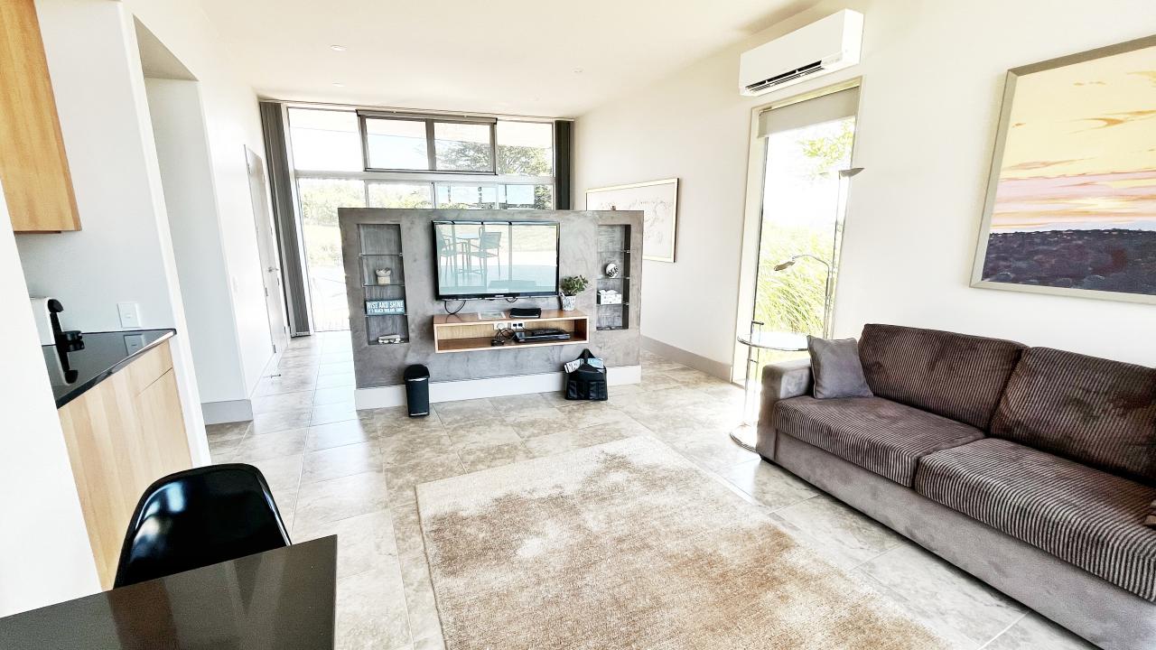 Our Moana, Oriwa, and Aria Suites consist of a small living area with kitchenette (fridge, kettle, espresso machine, toaster),  a Kingsize bed and an en-suite bathroom. The Aria Suite is wheelchair accessible.