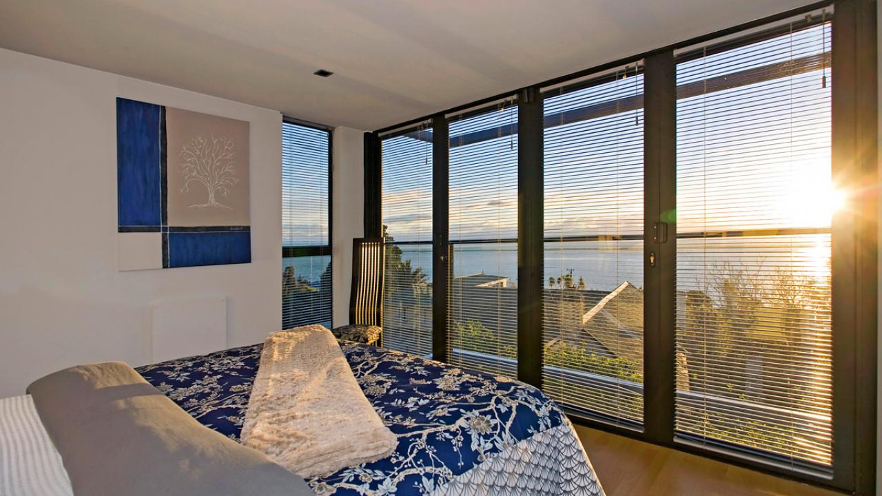 Golden glow of sunset in the master bedroom.