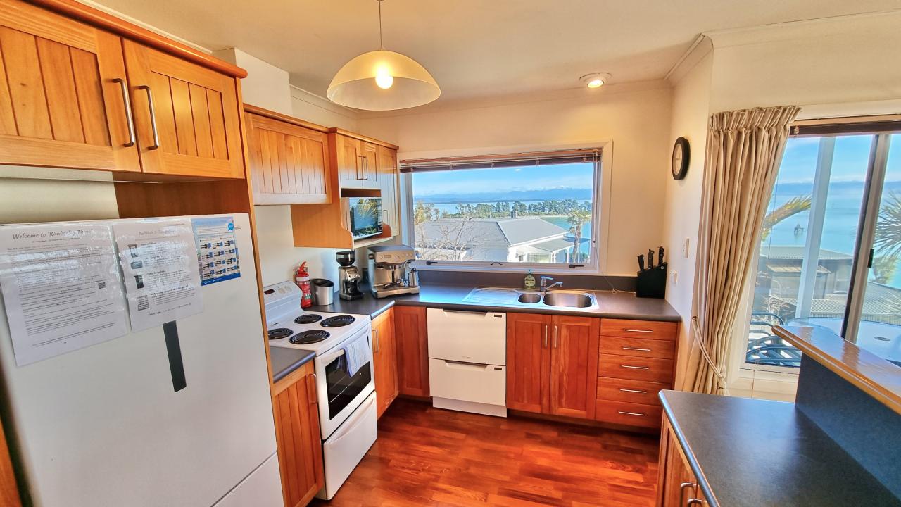 Fully equipped kitchen with quality espresso machine with grinder & views