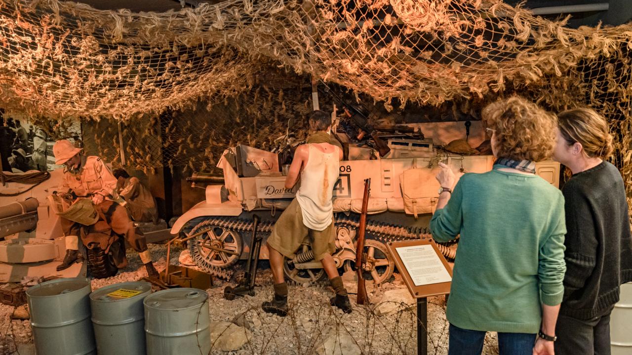 Dramatic dioramas depict various military scenes, from the heat of the battle to quiet moments in the trenches.