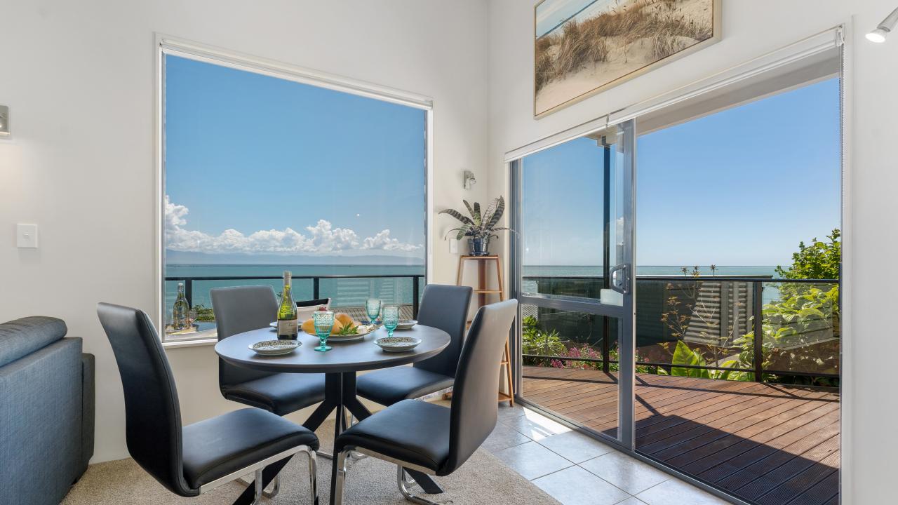 Dining area opening to balcony deck