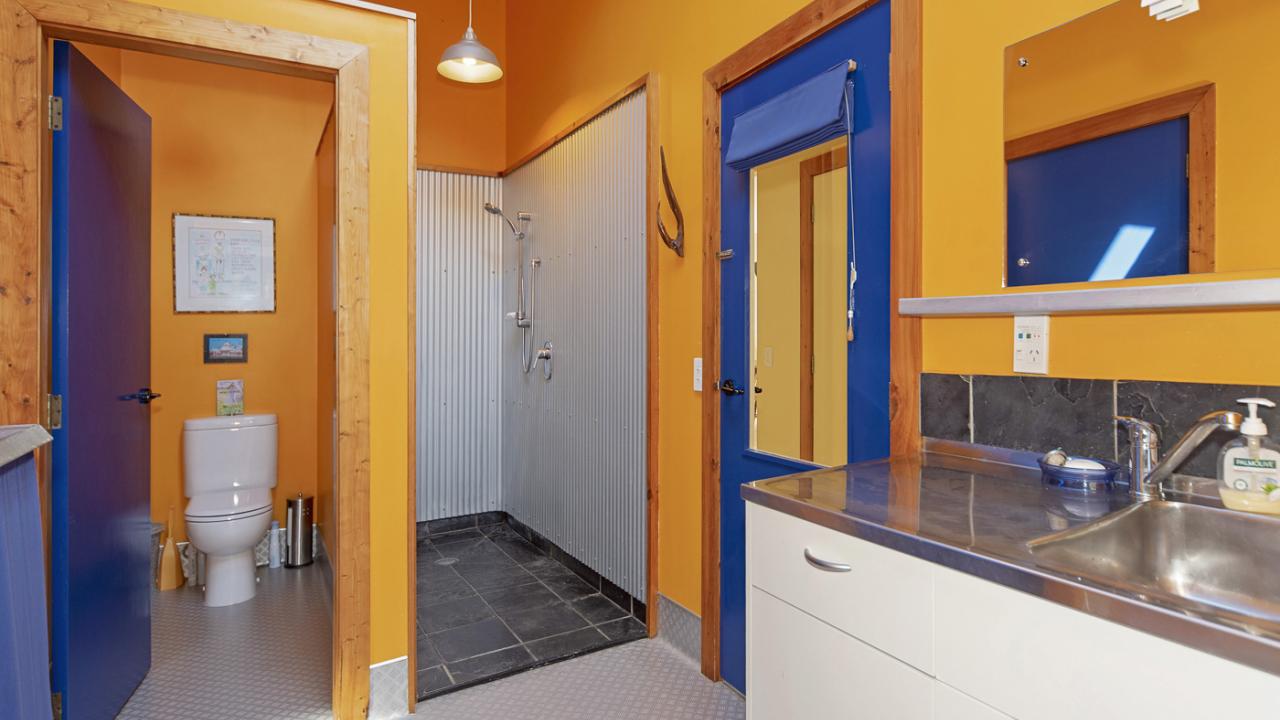 Bathroom 2 & Laundry area with Shower, Toilet, Sink and washing machine