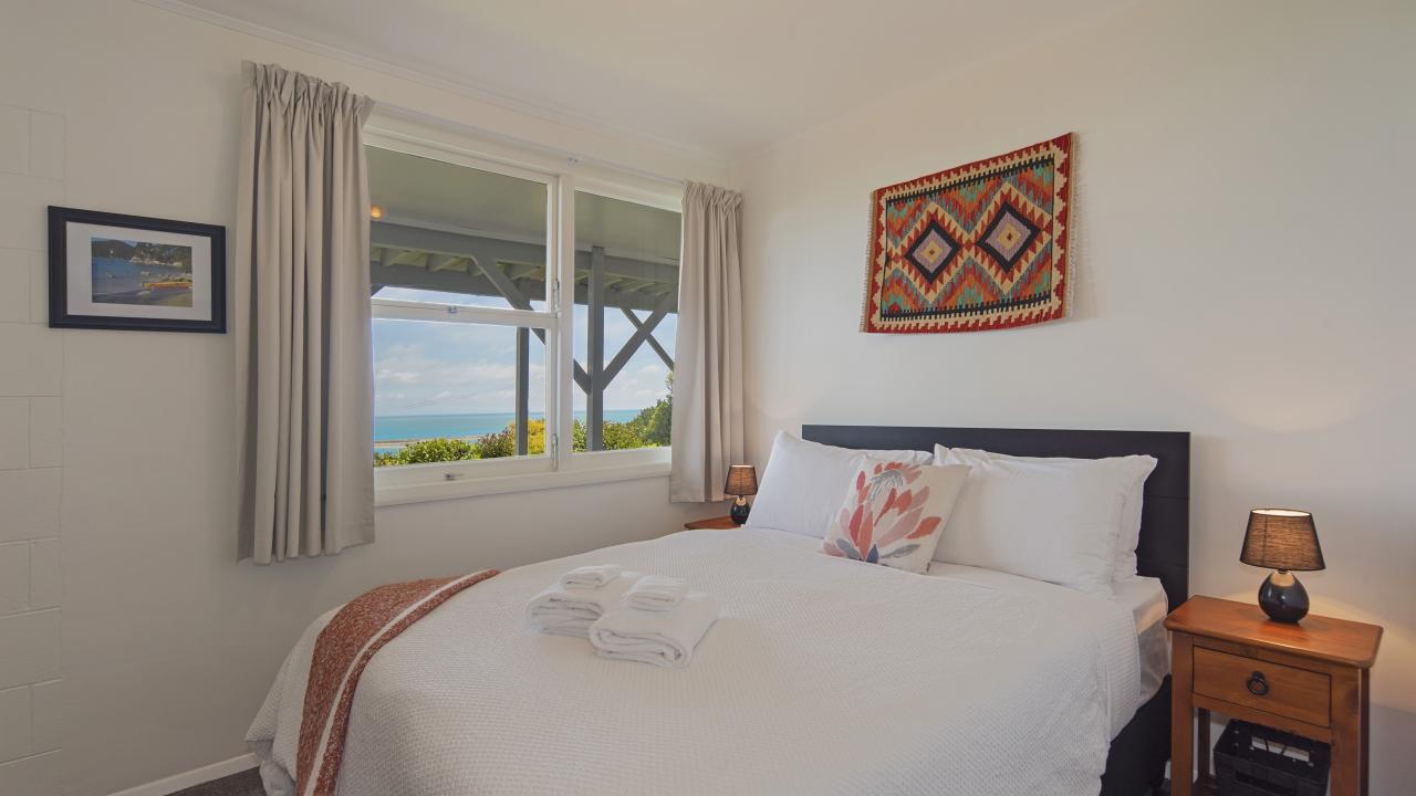 Bedroom 3 (Downstairs) with Queen bed & Sea views