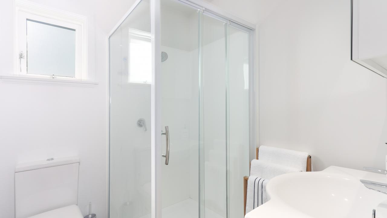 Downstairs bathroom with shower, toilet & vanity