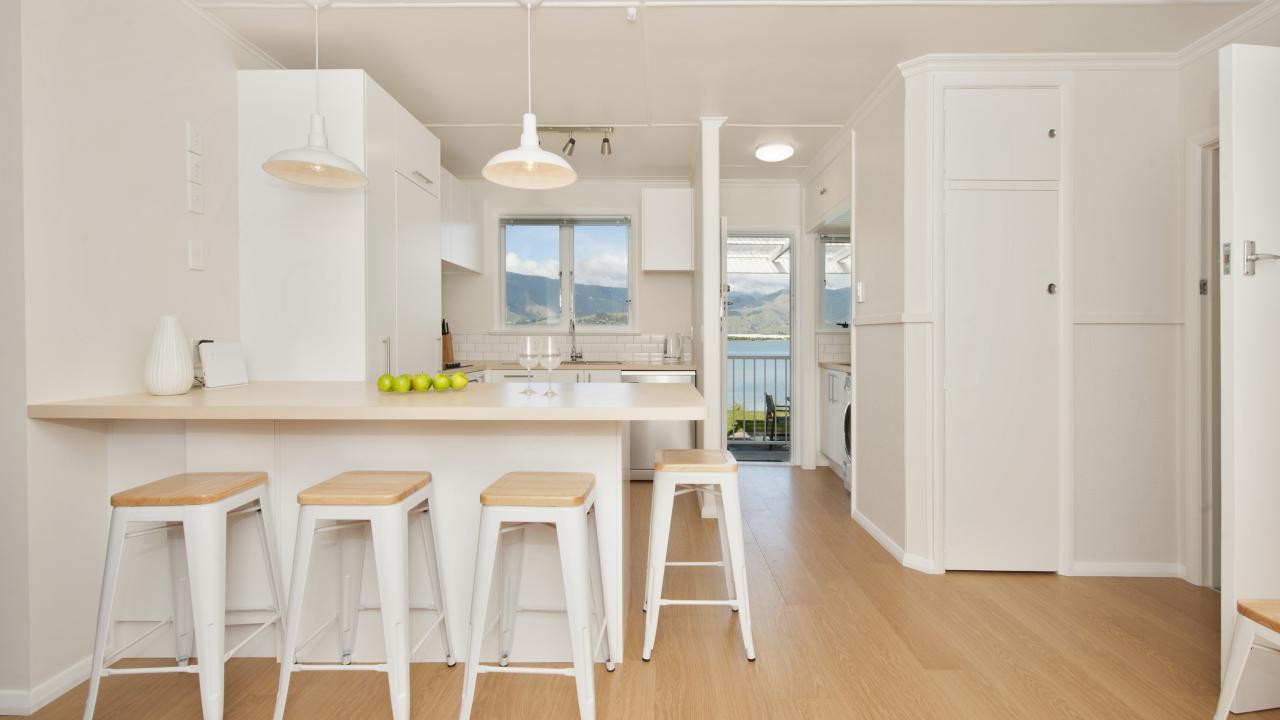 Fully equipped kitchen with dishwasher & views.
