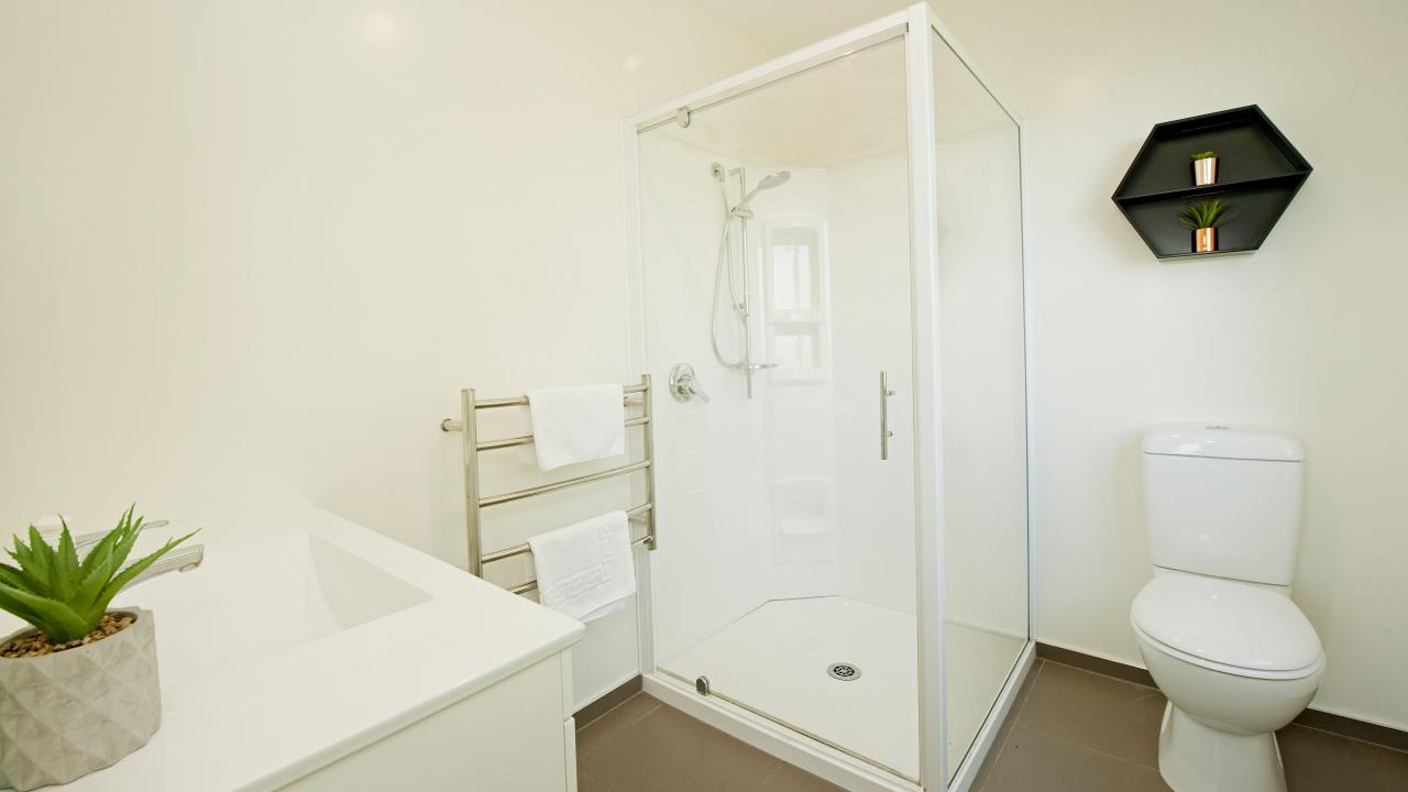 Master ensuite bathroom, tiled. With Shower, Toilet & Vanity.

