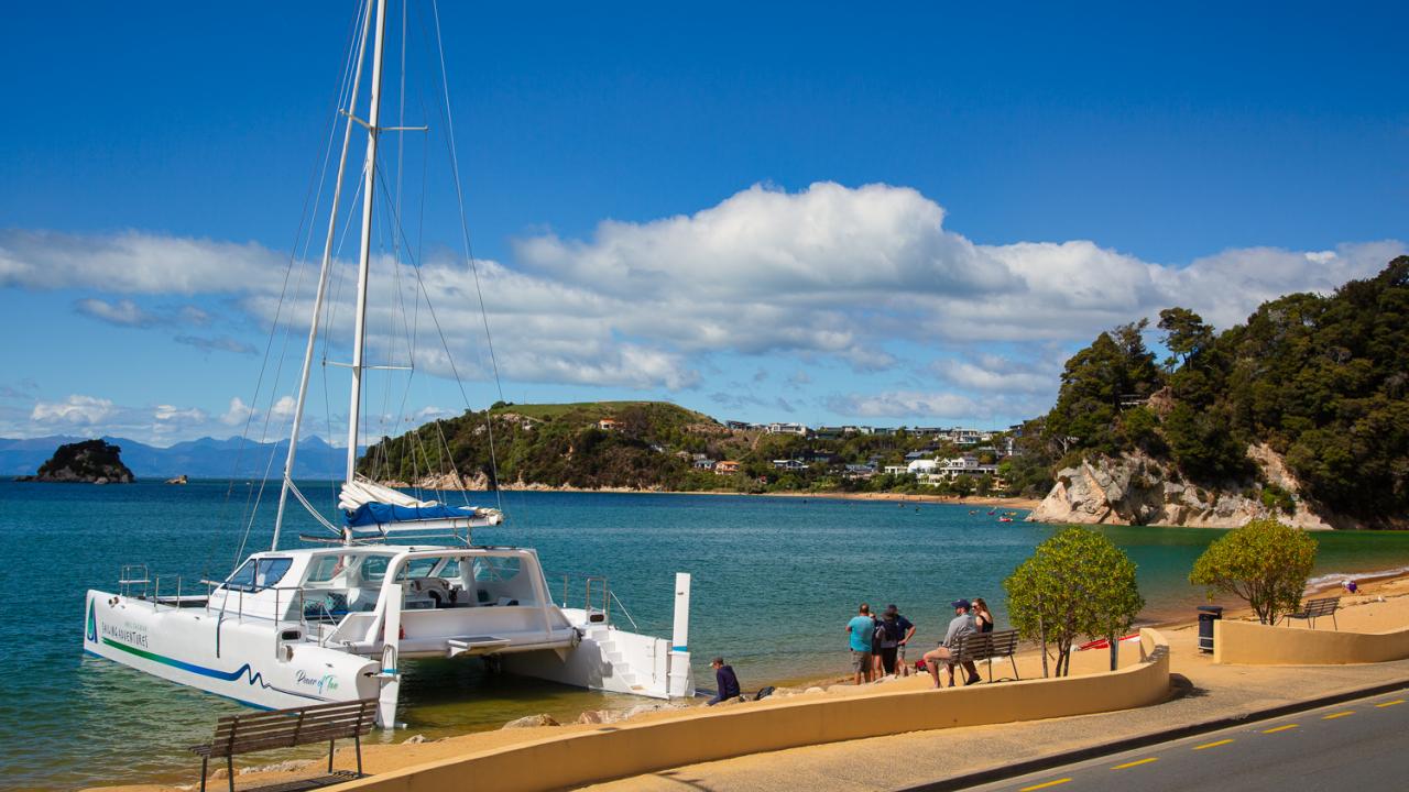 Boarding the catamaran at Kaiteriteri Beach. 