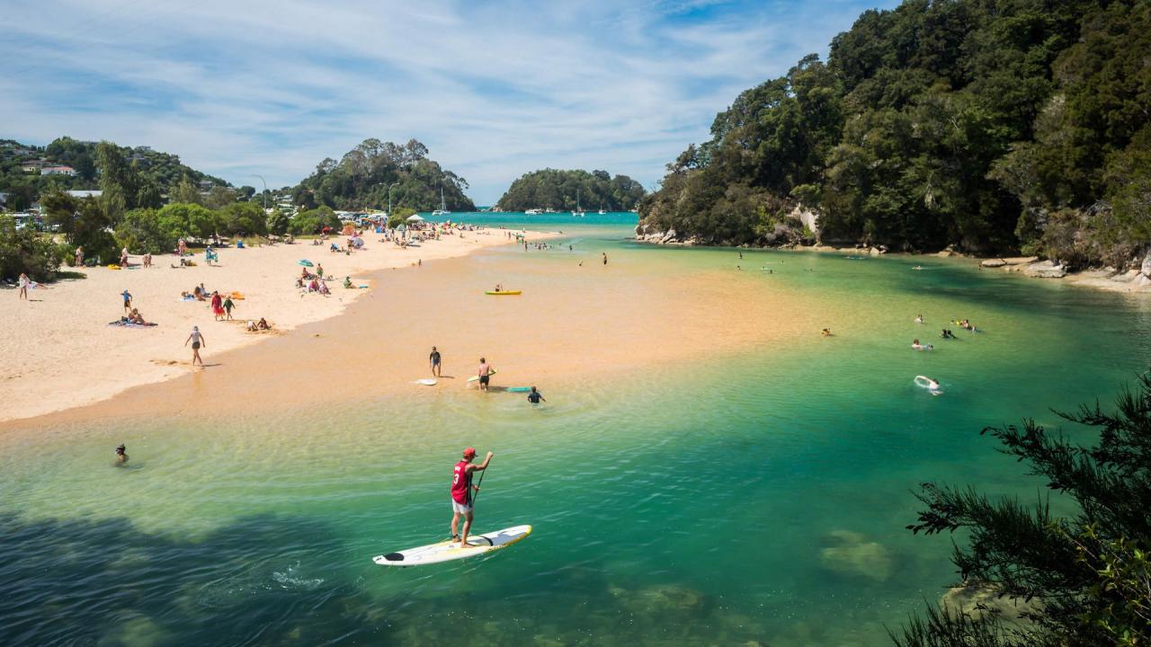 Kaiteriteri beach, clear blue water, and golden sands.