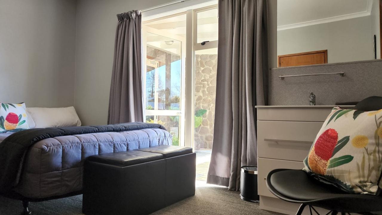 Lodge room at Plateau Lodge communal Lounge & Kitchen & bathrooms.  Double bed & set of bunks with tea & coffee.