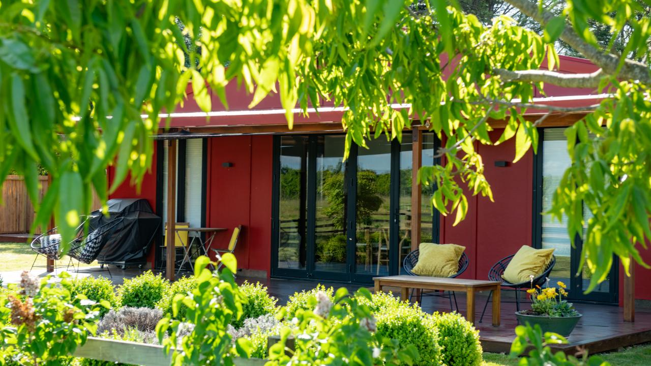 The Retreat is set in a private garden surrounded by mature trees.