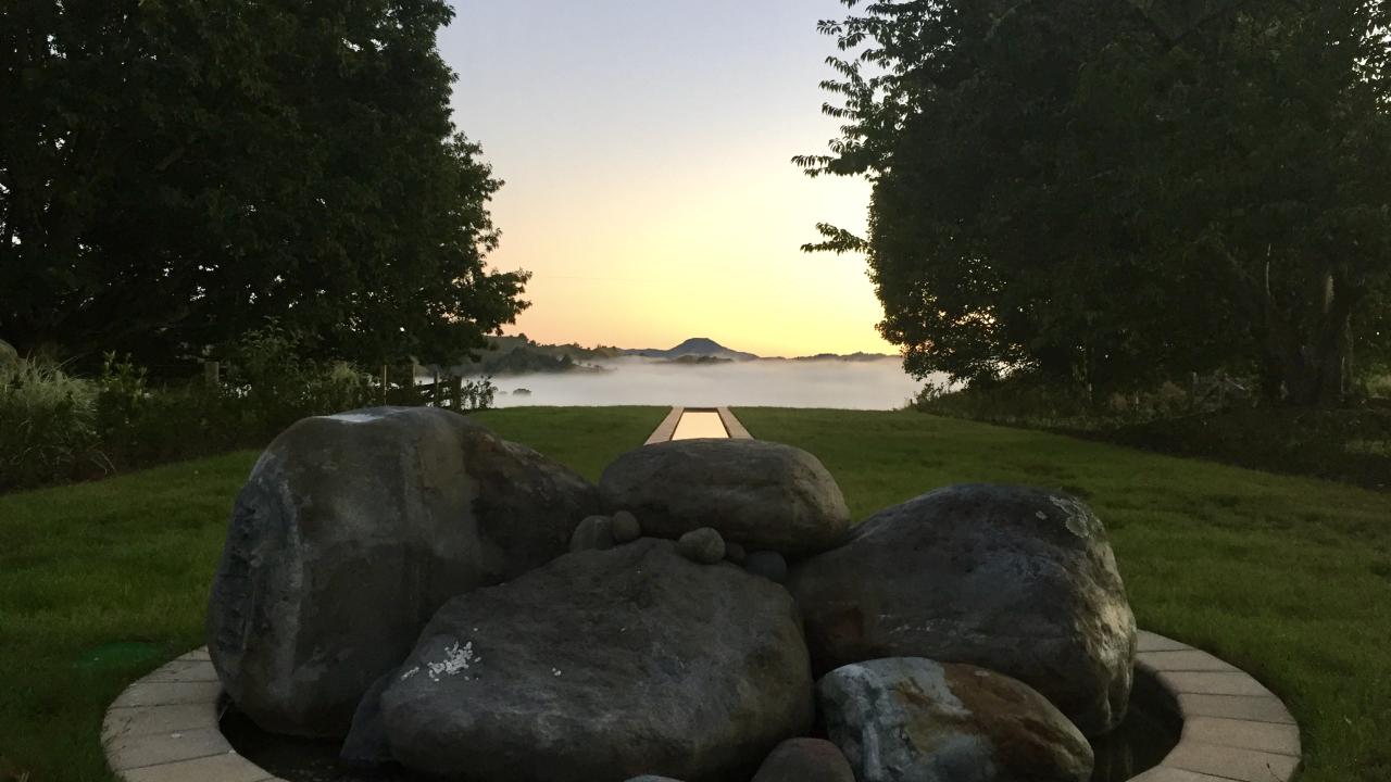 The Rill water feature overlooking Mount Hikurangi at dawn.