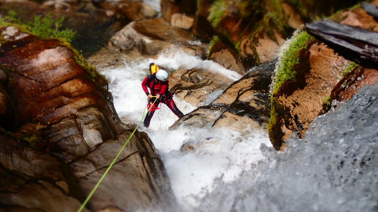 Abseiling through waterfalls on our way down Waterfall Creek