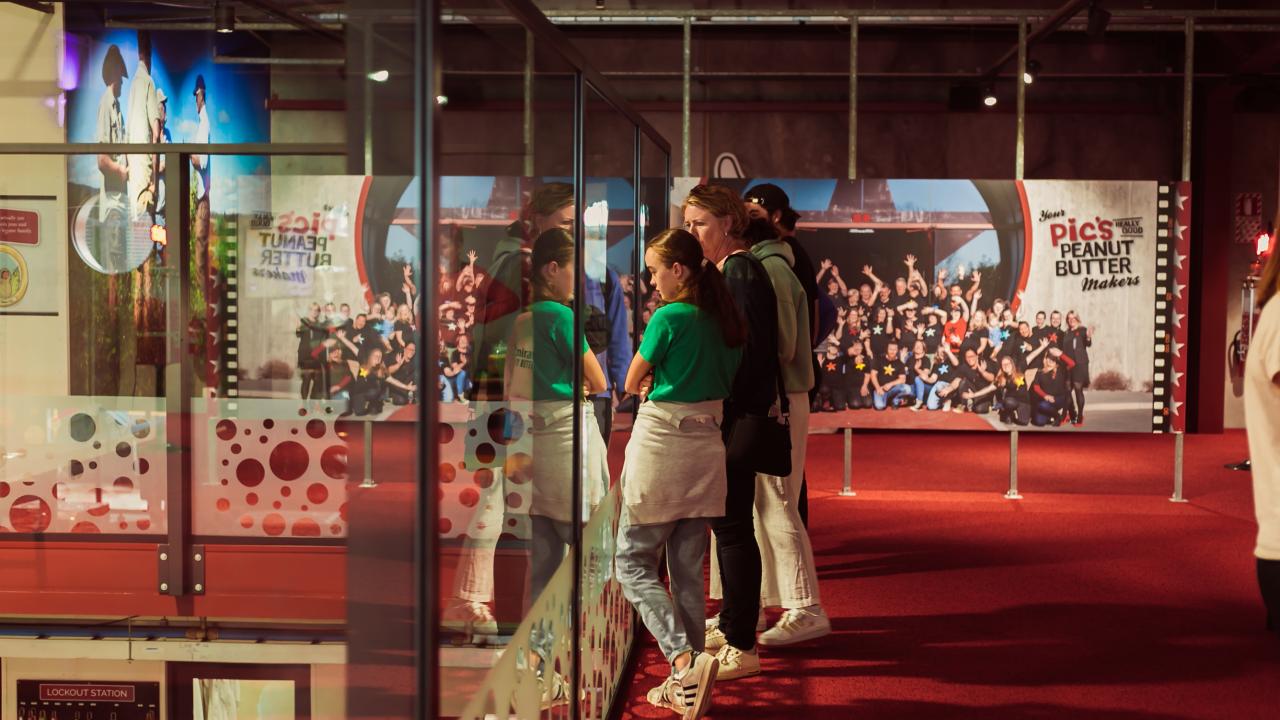 Tour attendees looking down onto the production floor.