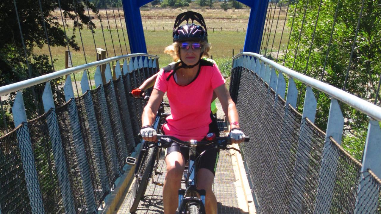 Crossing the swingbridge on the coastal section of the Great Taste Trail between Nelson and  Mapua 