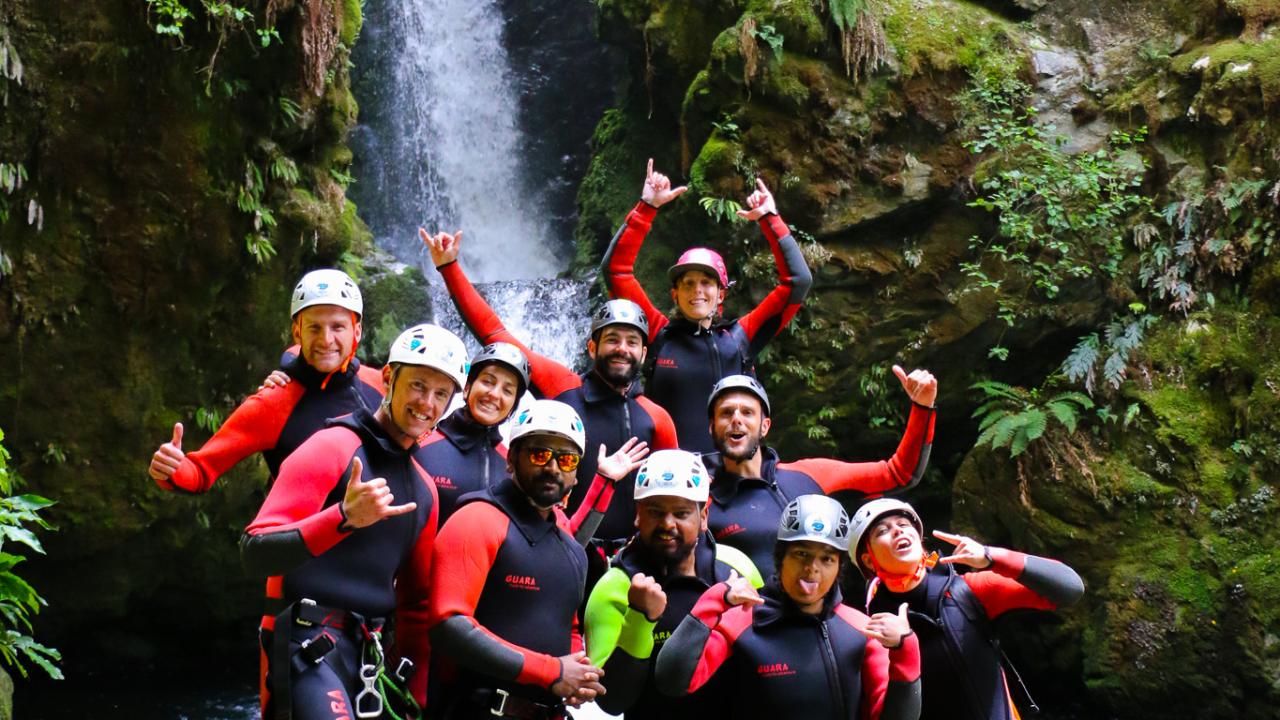 Happy group into hidden falls