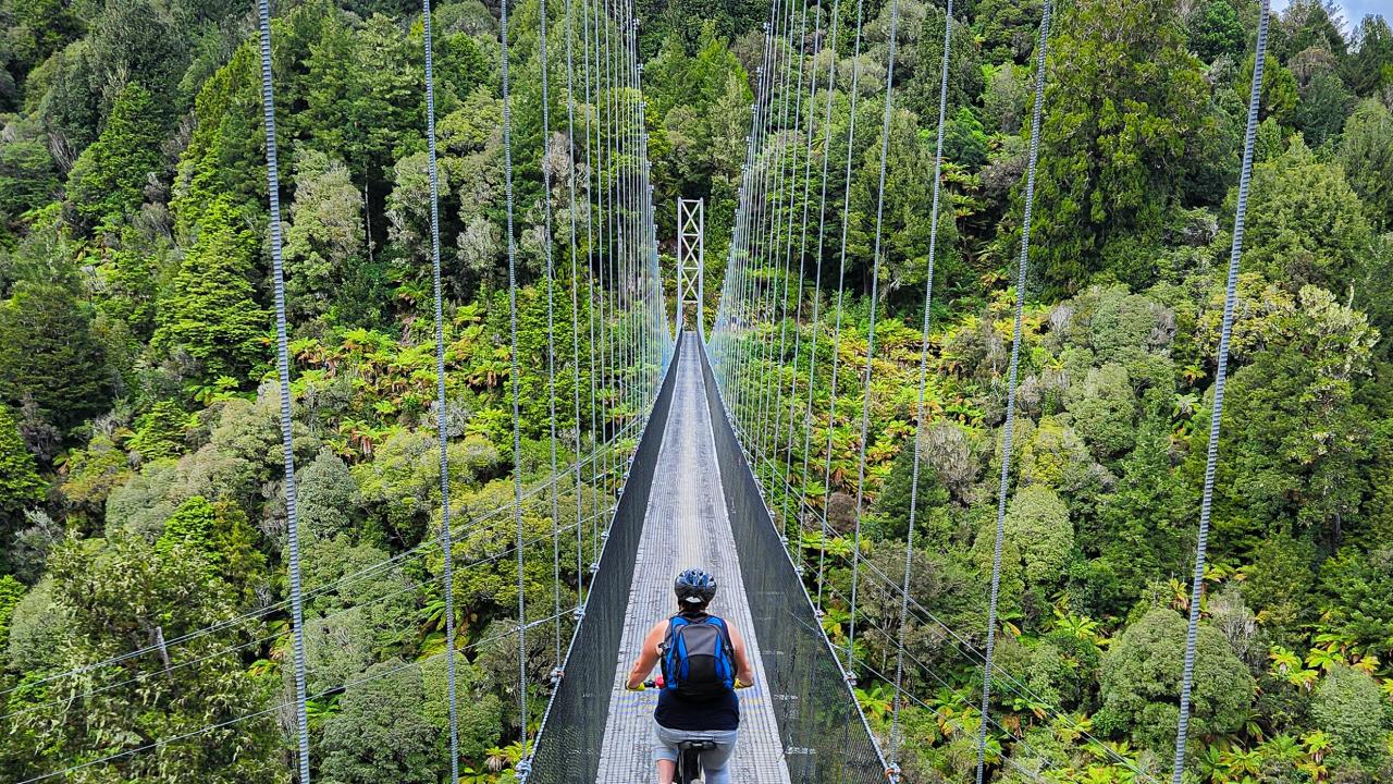 Ride over spectacular suspensions bridges - such as Maramataha Bridge here