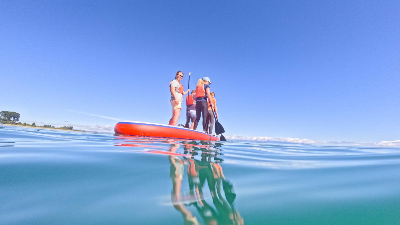 Up to 10 people can jump on our giant paddleboard.