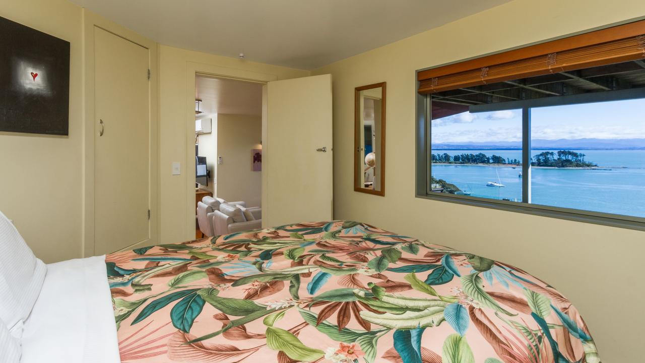 Comfortable Queen size bed with stunning views over Tasman Bay & the harbour entrance