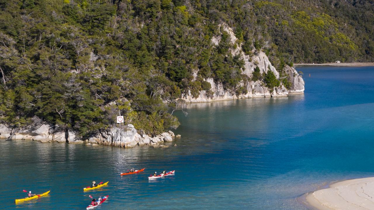 Paddle the days away in the Abel Tasman National Park.