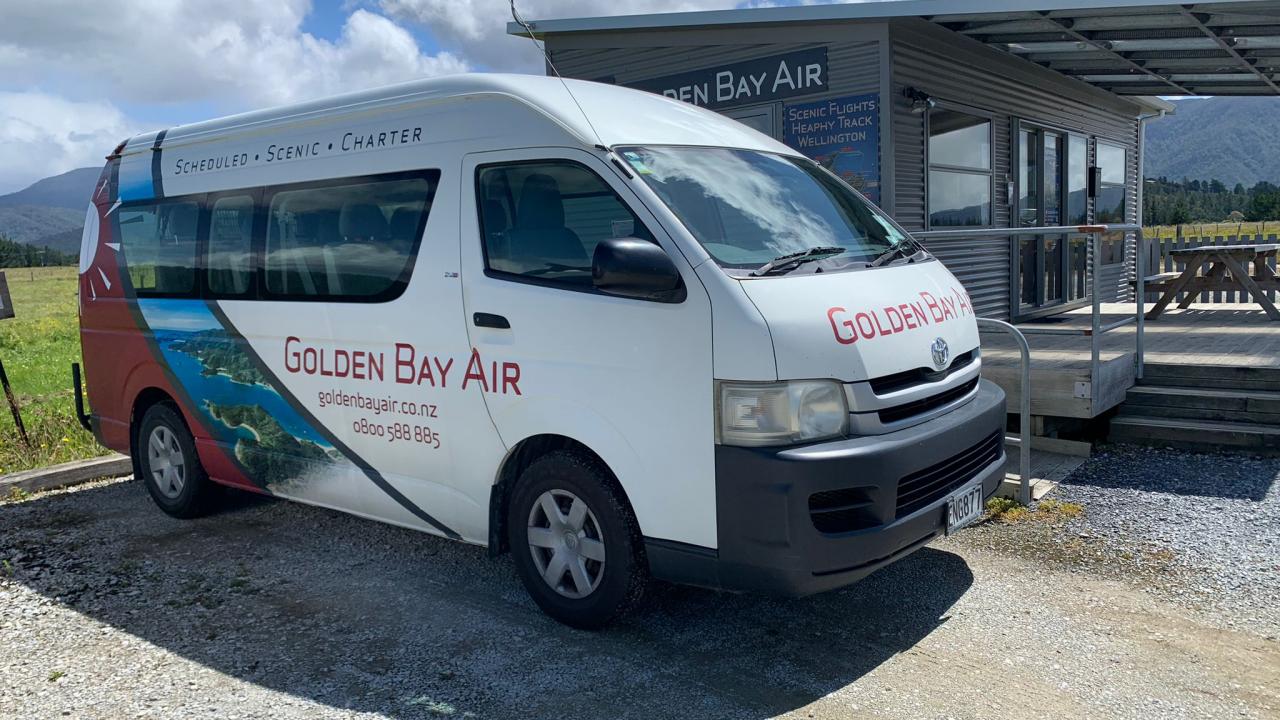 Golden Bay Air shuttle bus outside our Tākaka Terminal