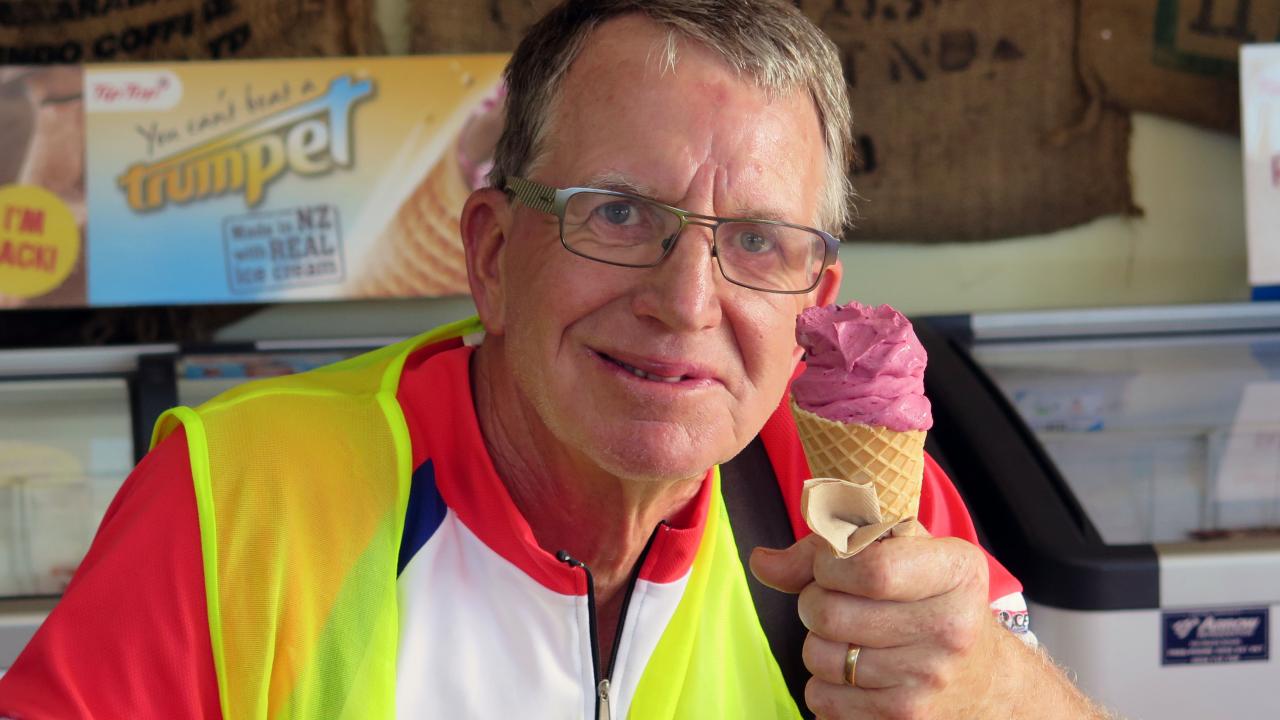Cyclist relishing a delicious fresh berry ice-cream