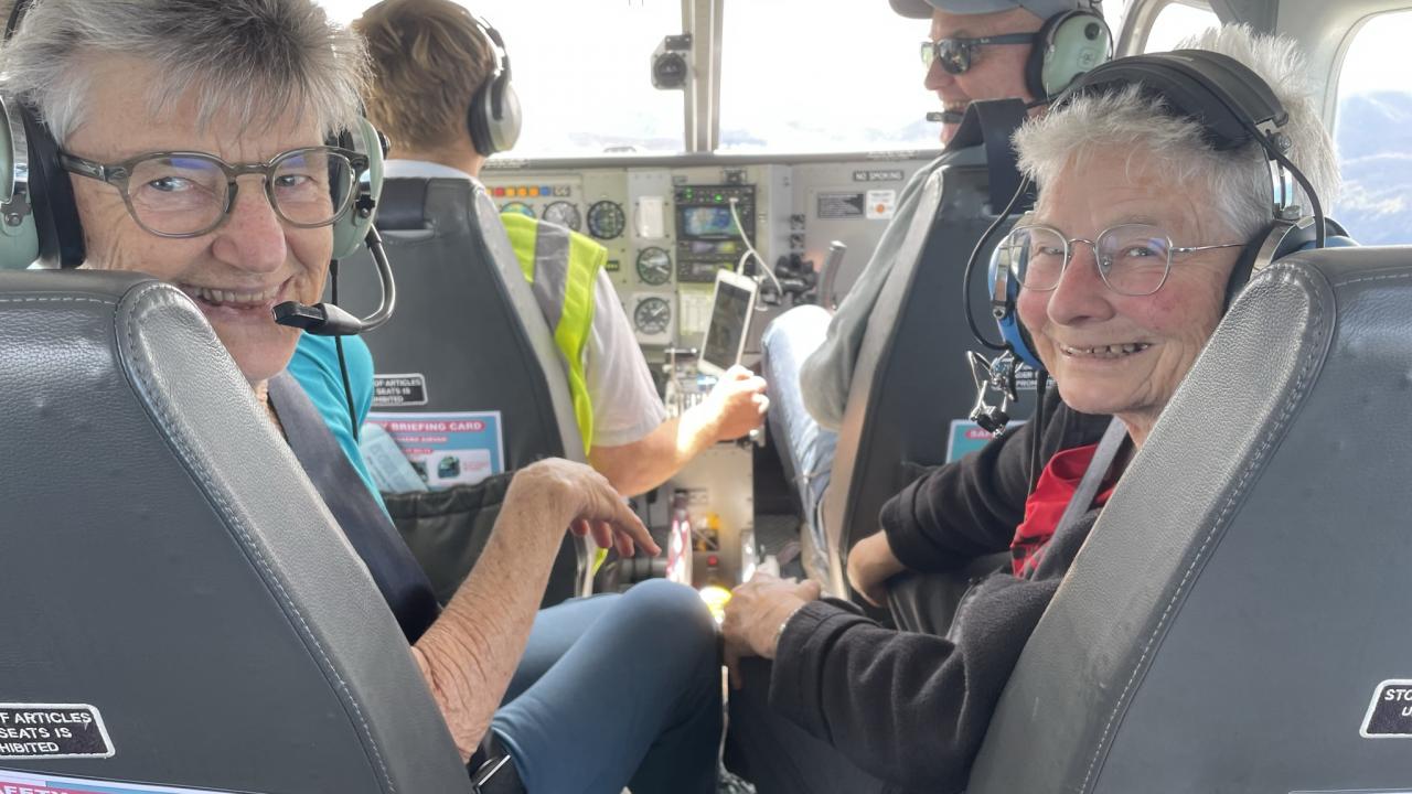 Happy passengers on a Golden Bay Air scenic flight
