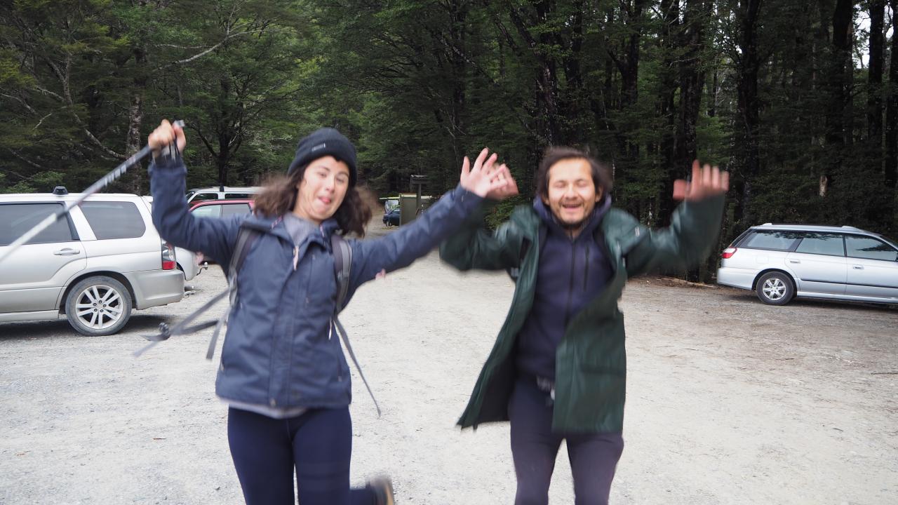 2 happy trampers glad to see the shuttle waiting for them.