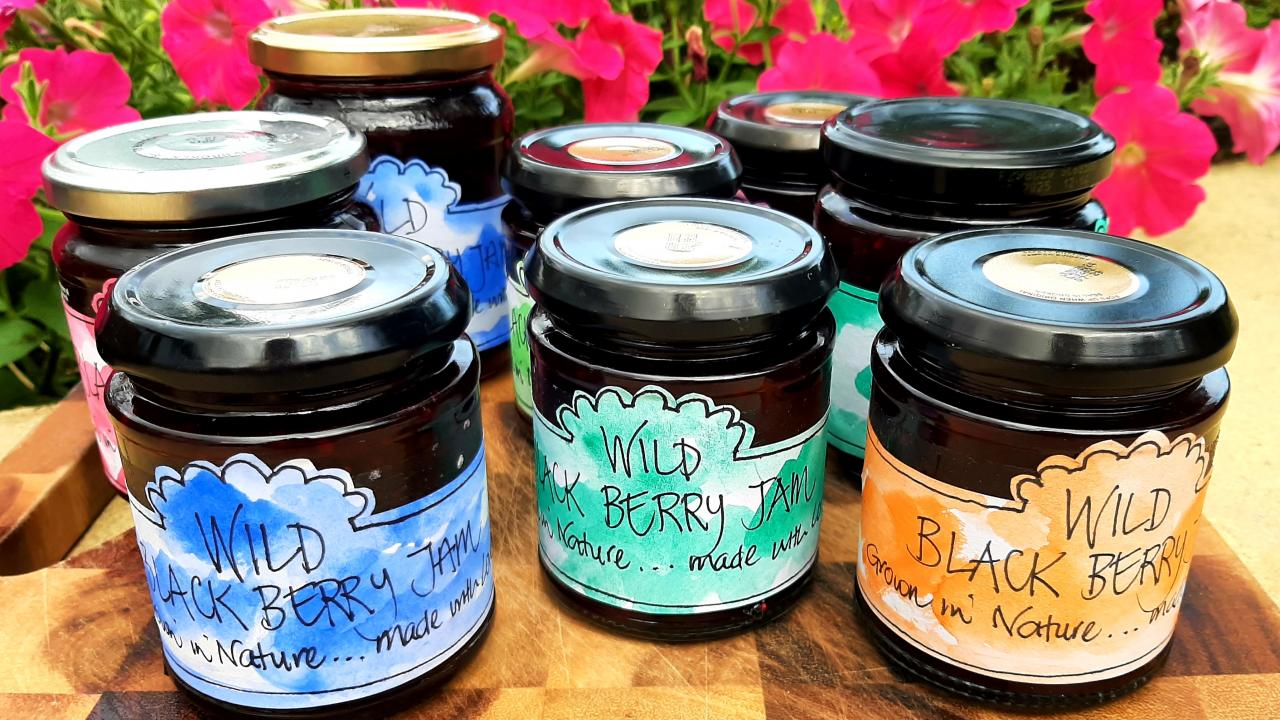 Blackberry jam with hand-drawn labels made at our Jam-Making Workshop.