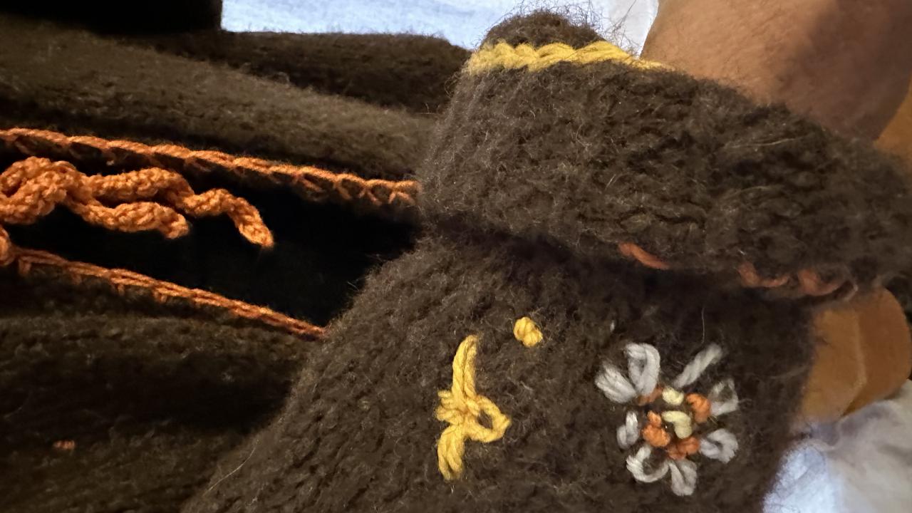 A student's cute little embellishments of a piece of clothing, created at their Embellish Me Workshop.