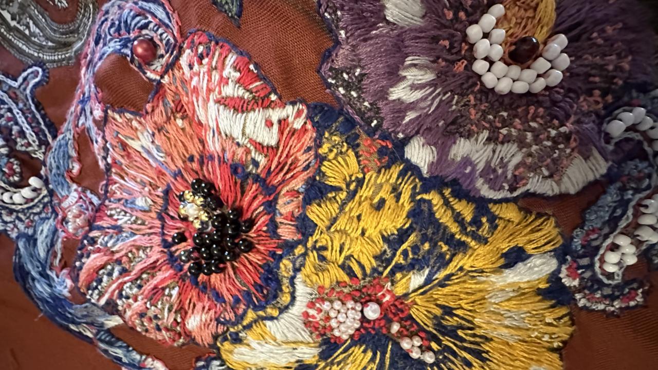 A student's floral embellishment of a piece of clothing, created at their Embellish Me Workshop.