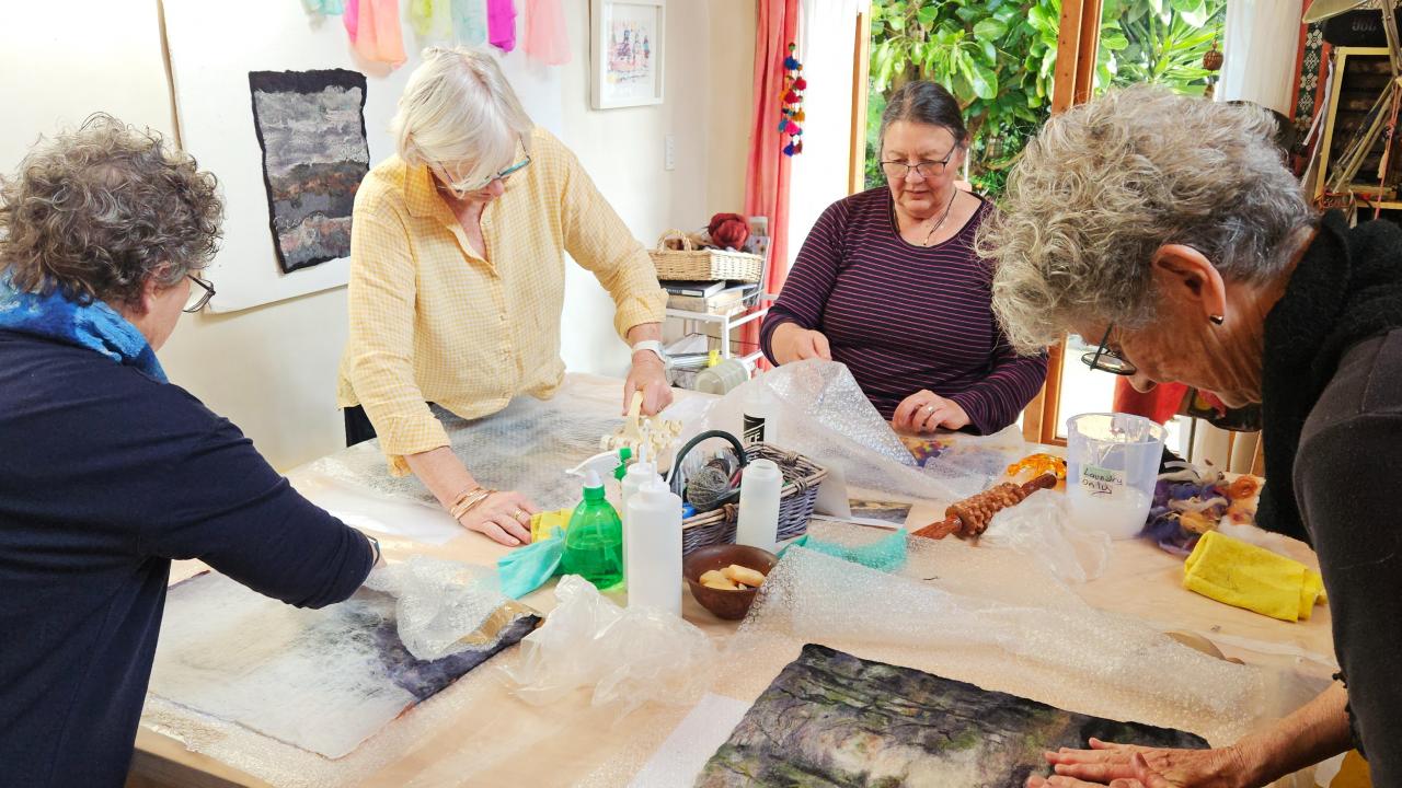 A group of students work on their designs during their Contemporary Feltmaking Workshop.