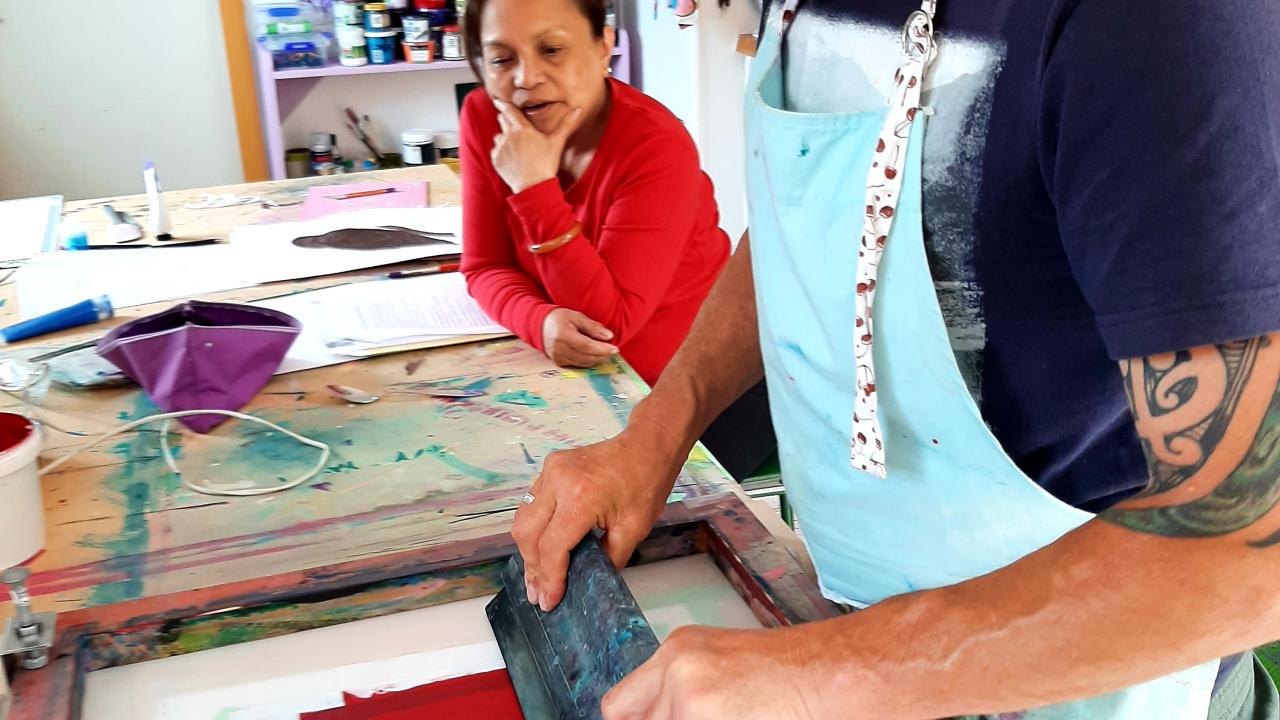 Students print their own designs onto fabric and paper at their Mates Screen Printing on T-Shirts Workshop.