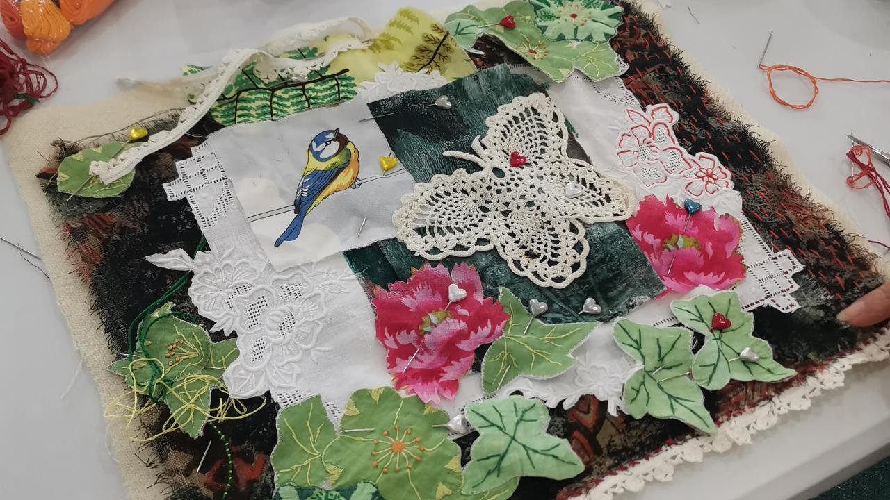 A student's collaged artwork made at their Textile Collage Stitch Workshop.