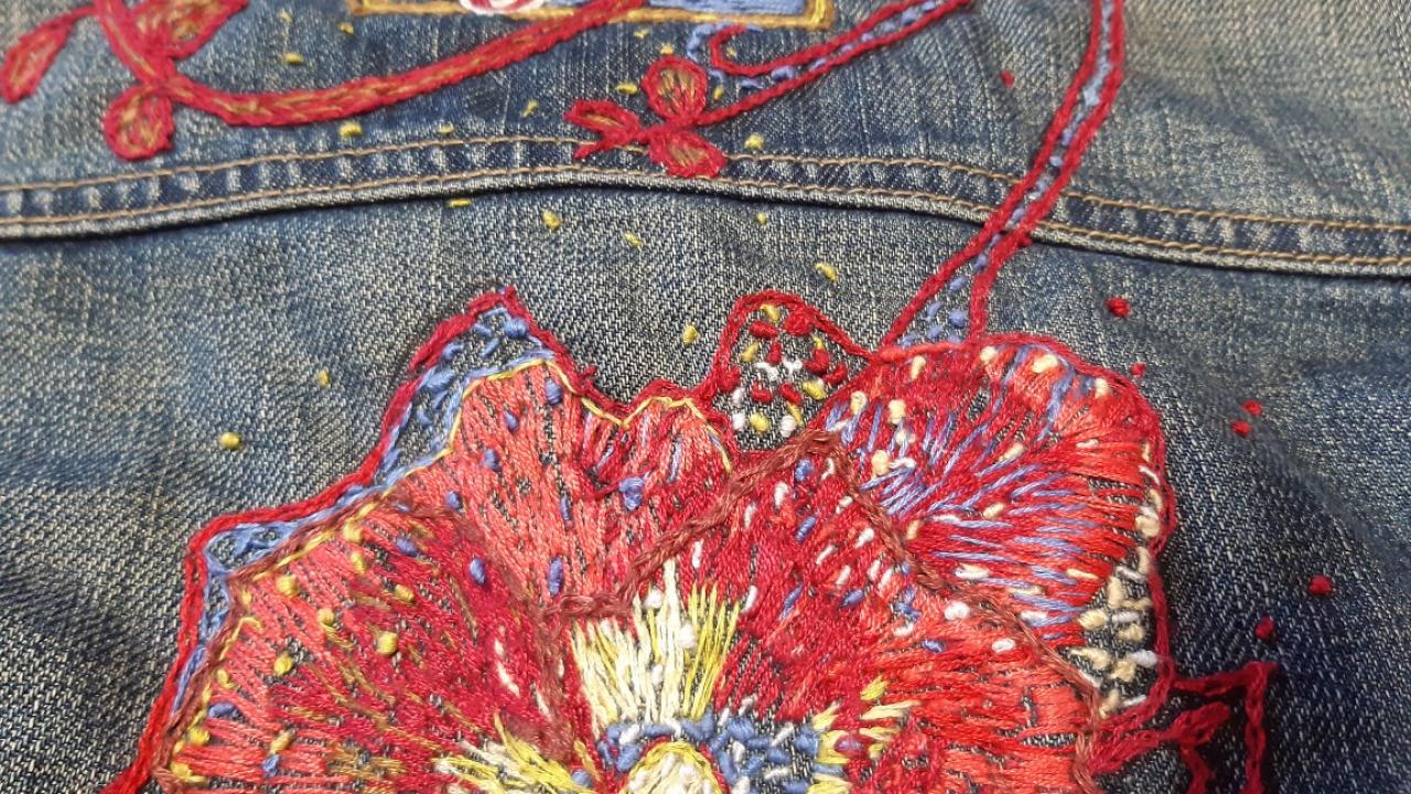 A student's floral embellishment of a piece of clothing, created at their Embellish Me Workshop.