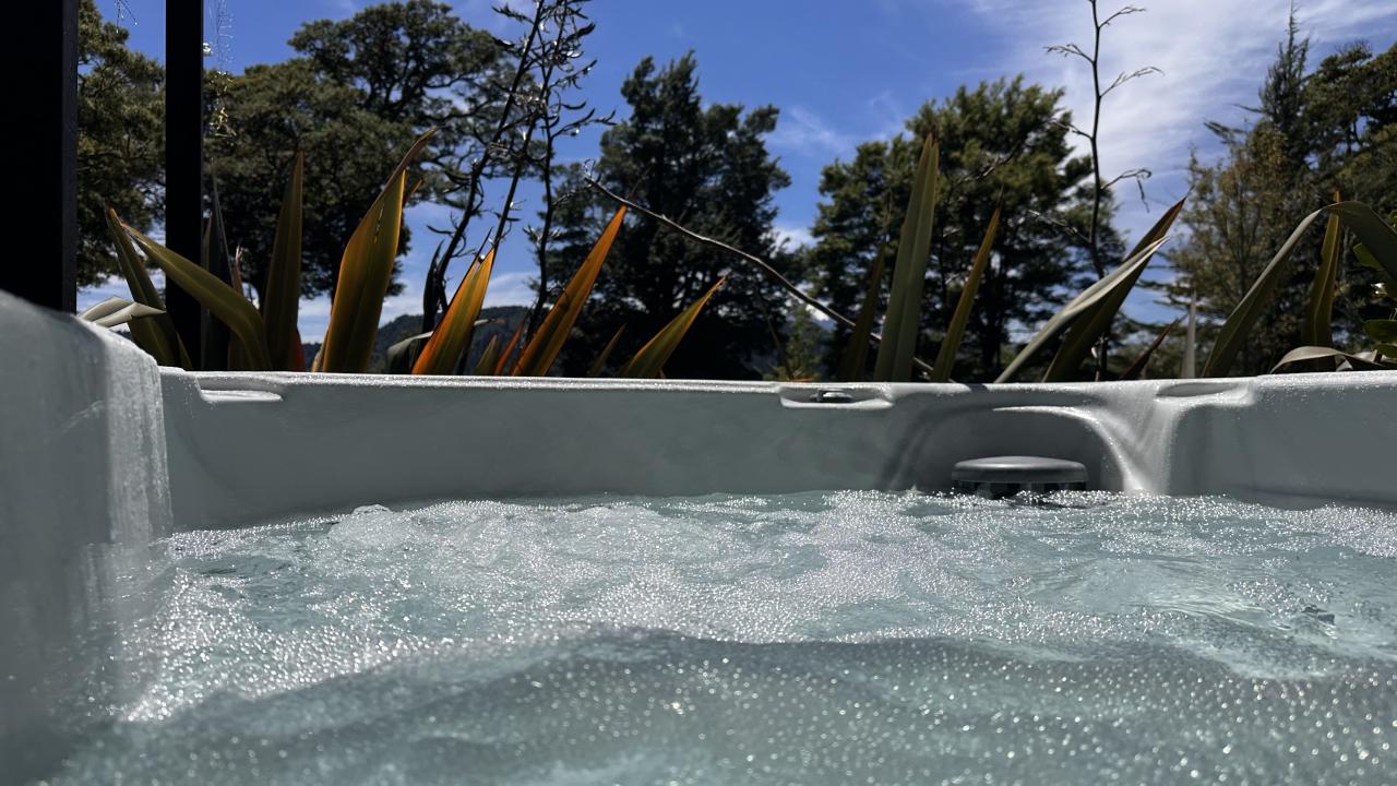 One of the spa pools at Two Rivers, relax with views of Mt Ruapehu.